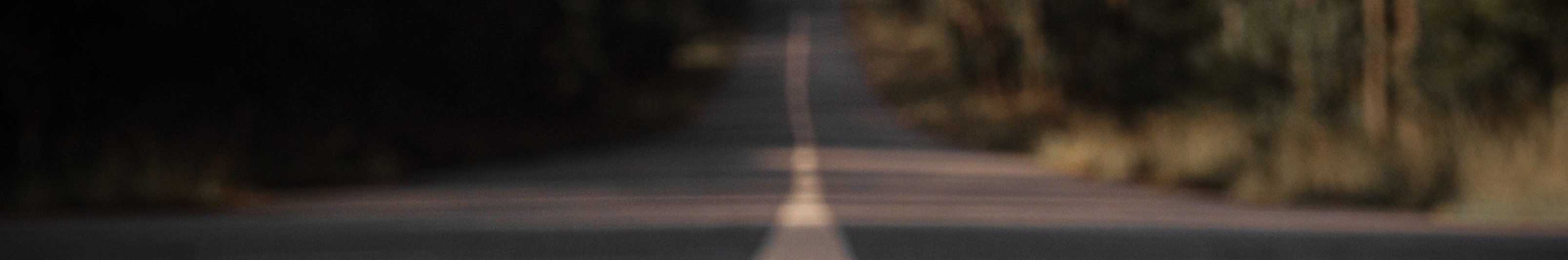 Look down the white line of a paved road 1